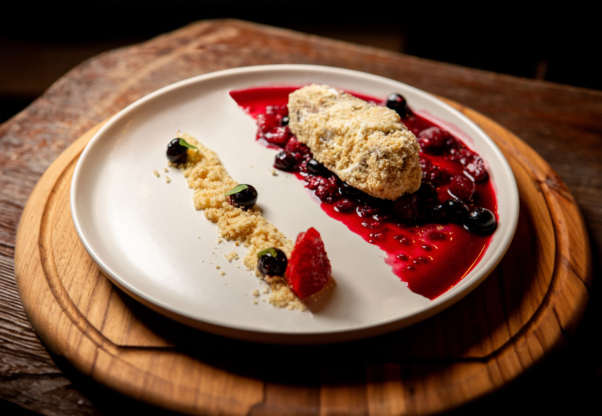 Fried vanilla ice cream with malanga powder and berry sauce